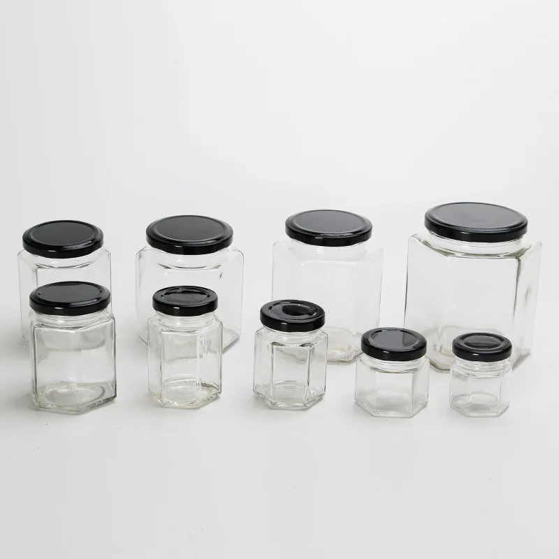Glass honey jars in several sizes with matching metal lids