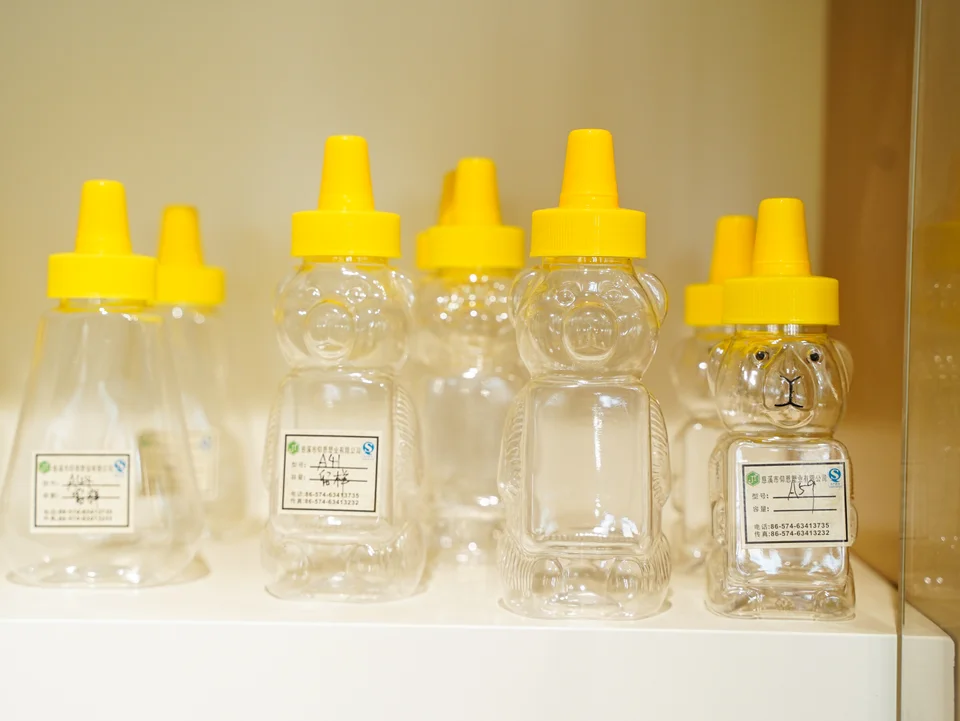 Gracepack sample shelves displaying honey bear bottles and other packaging
