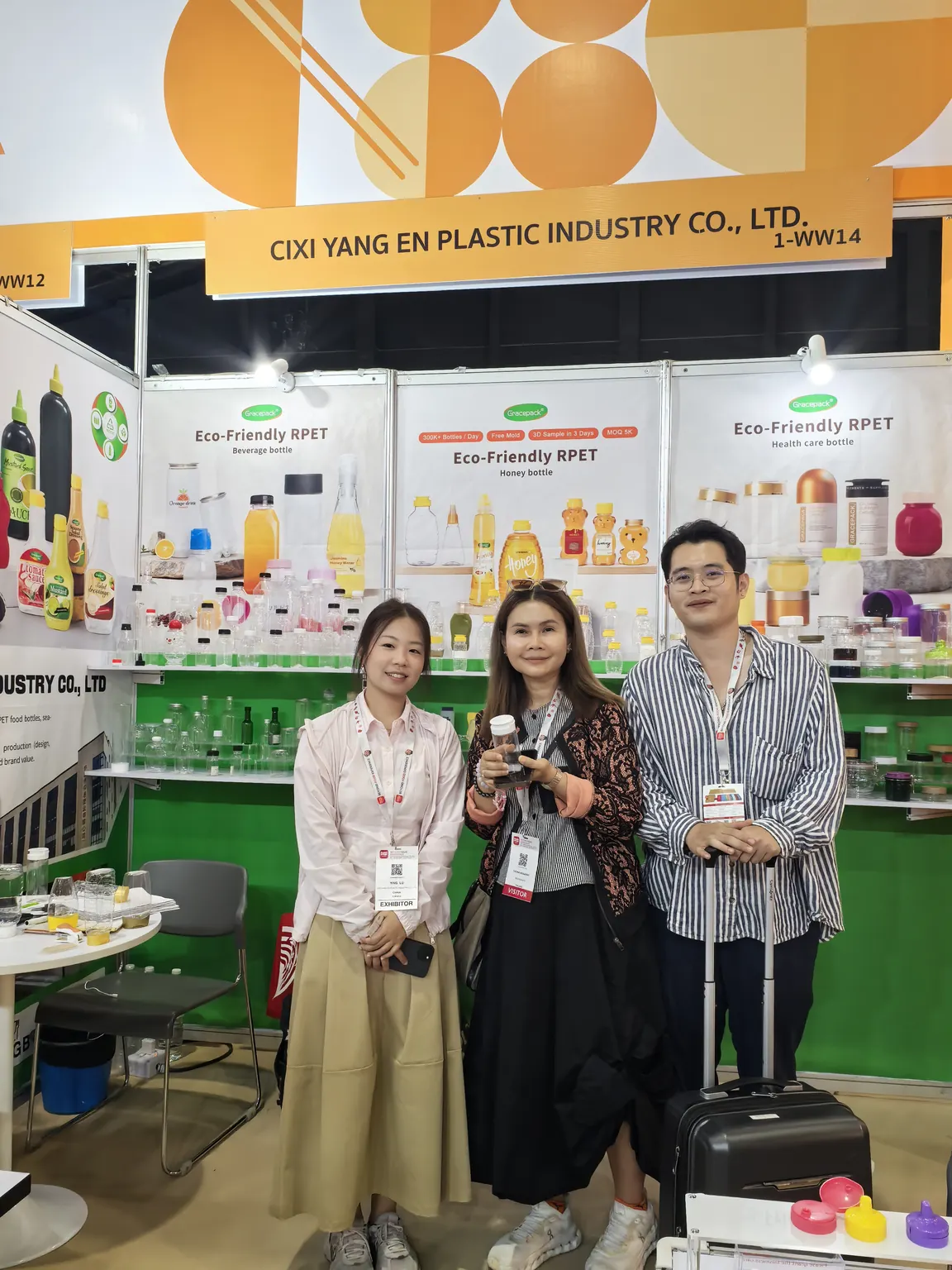 Gracepack representatives with a visitor at the THAIFEX exhibition booth in 2026